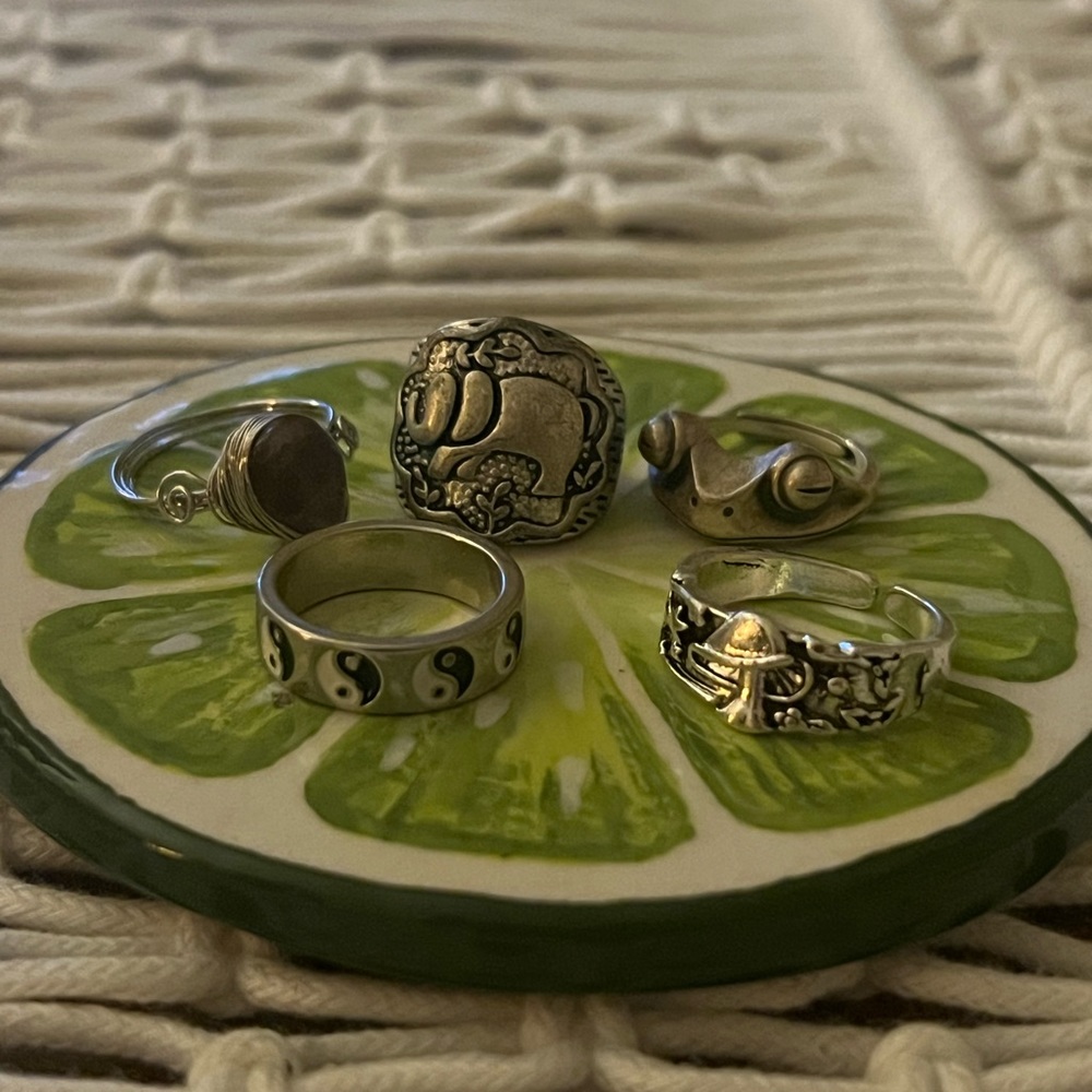 collection of random silver rings , size 7